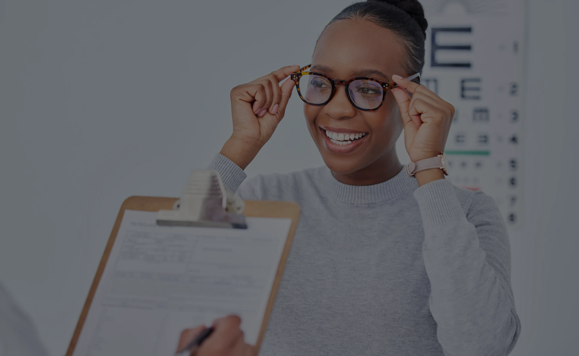 African American using eyeglasses at clinic