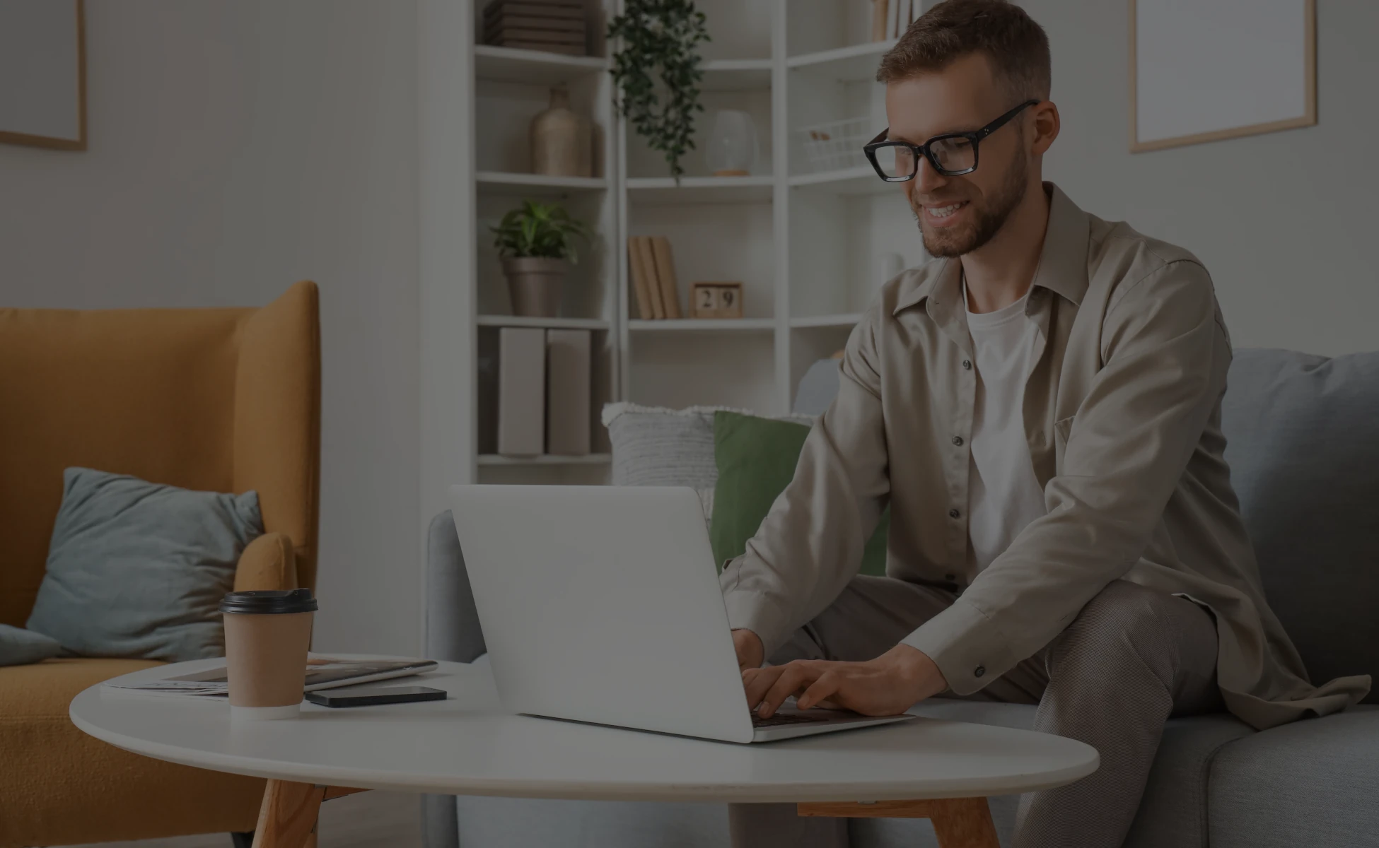 Man wearing eyeglasses using laptop